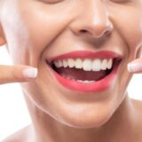 Healthy smile representing common myths and facts about oral health