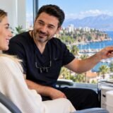 Turkish dental specialist discussing natural smile treatments with a UK patient during a dental consultation